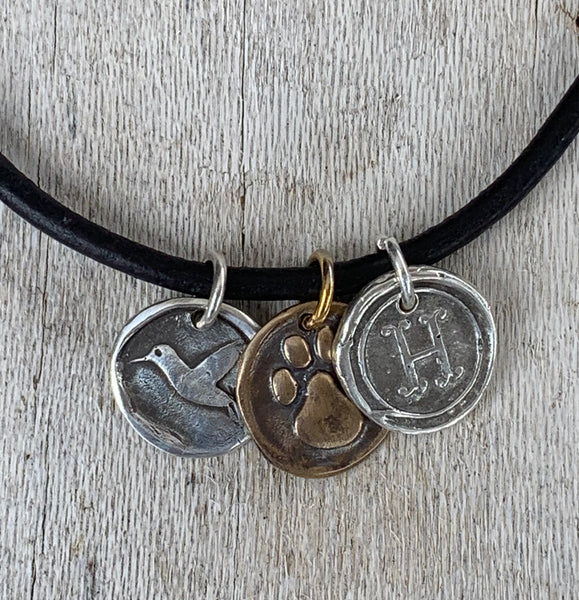 Four Legged Friend Memorial Leather Necklace with Sterling Silver Letter and Hummingbird Charms with Bronze Paw Charm